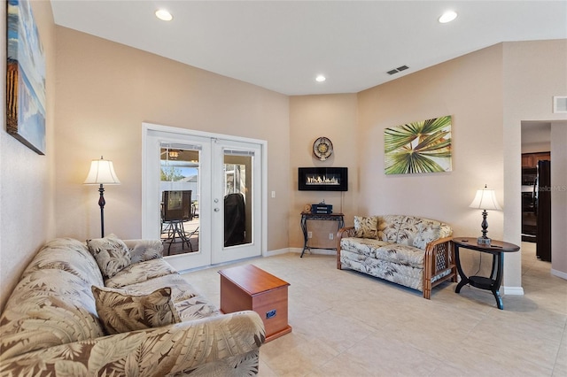 living area featuring visible vents, recessed lighting, french doors, and baseboards