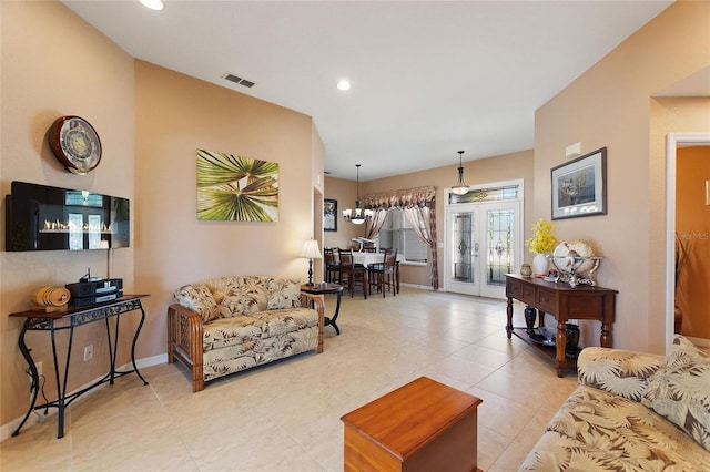 living room with visible vents, a notable chandelier, recessed lighting, light tile patterned floors, and baseboards