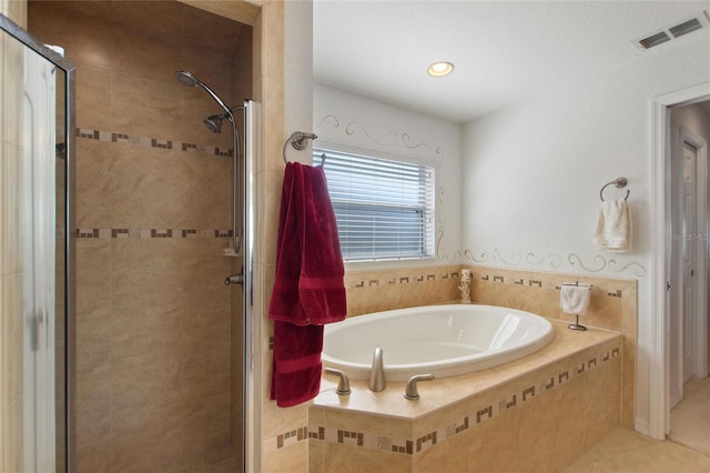 bathroom with tile patterned floors, visible vents, a stall shower, and a garden tub