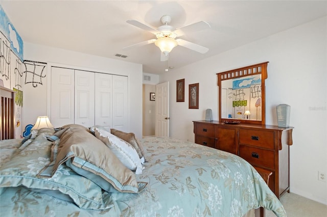 bedroom featuring a closet, visible vents, ceiling fan, and carpet floors