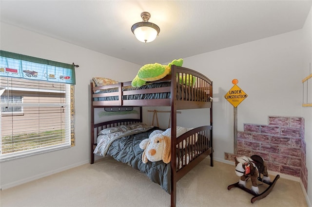 bedroom with baseboards and carpet floors