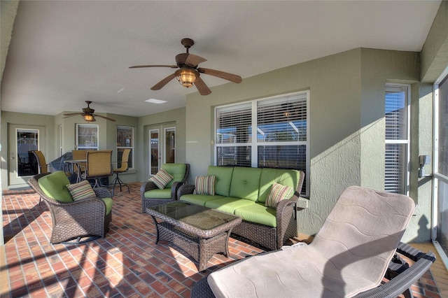 view of patio featuring an outdoor hangout area and ceiling fan