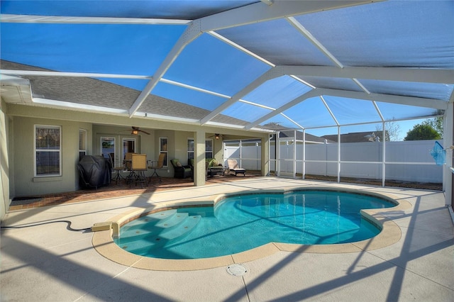 view of swimming pool featuring a fenced in pool, fence, a patio area, area for grilling, and a ceiling fan