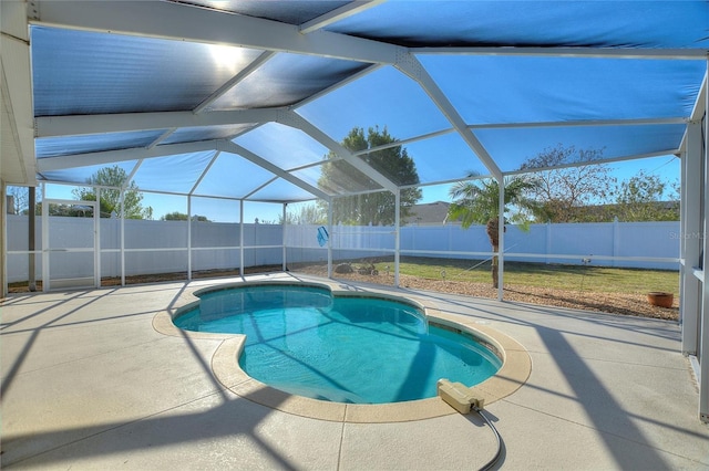 view of swimming pool featuring a patio area, a fenced backyard, a fenced in pool, and a lanai