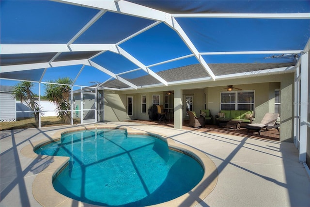 pool featuring a patio area, an outdoor living space, a lanai, and ceiling fan