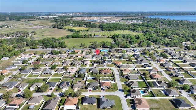 bird's eye view with a residential view and a water view