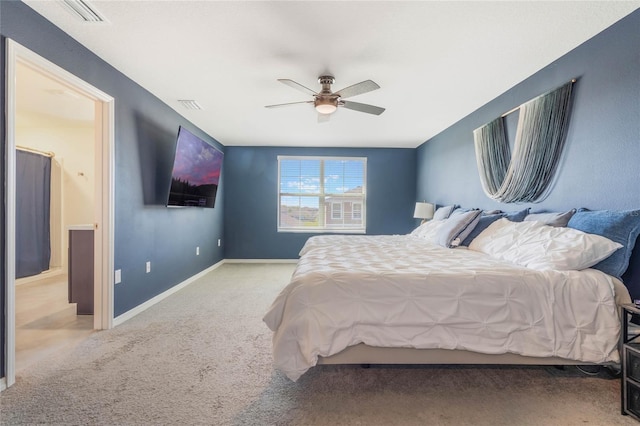 carpeted bedroom featuring a ceiling fan, baseboards, and visible vents