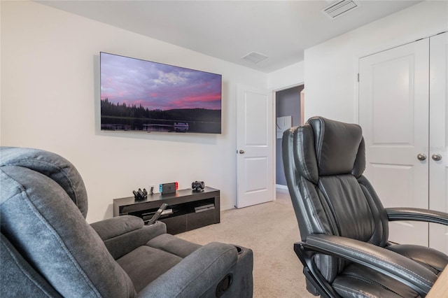 office space featuring visible vents, light colored carpet, and baseboards