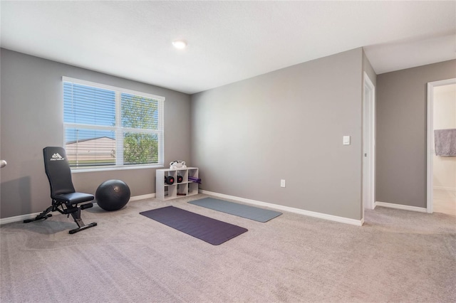 workout room with carpet flooring and baseboards