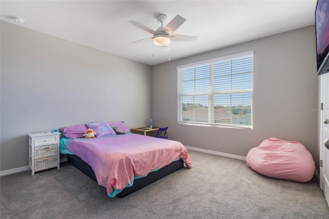 bedroom featuring a ceiling fan, baseboards, and carpet floors