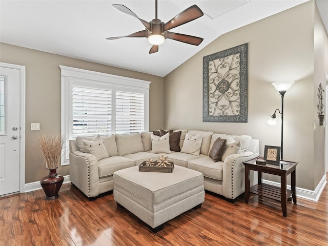 living area featuring baseboards, lofted ceiling, ceiling fan, and dark wood-style flooring