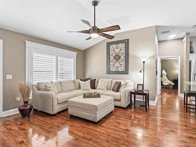 living room with visible vents, baseboards, ceiling fan, lofted ceiling, and wood finished floors