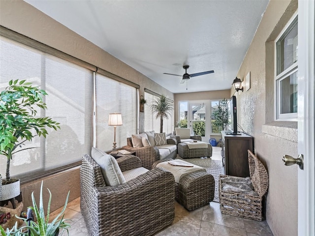 sunroom / solarium with ceiling fan