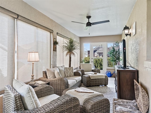 sunroom with ceiling fan