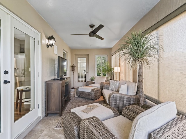 sunroom with a ceiling fan