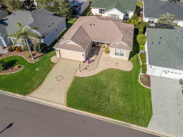 birds eye view of property with a residential view