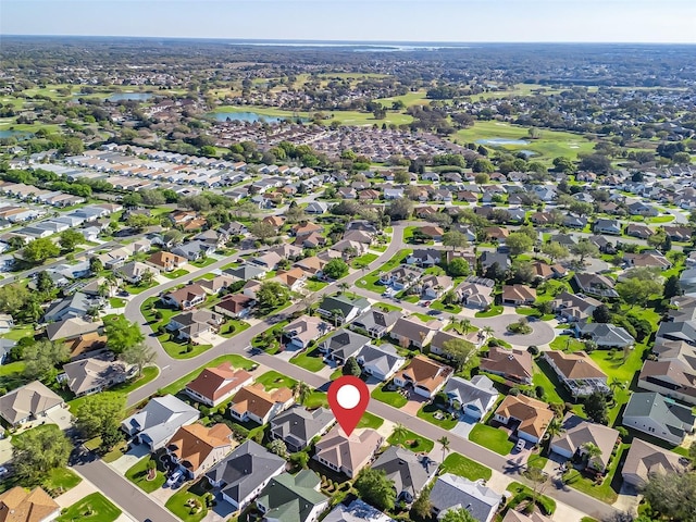 birds eye view of property featuring a residential view and a water view