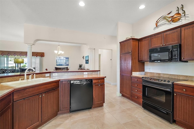 kitchen featuring light tile patterned floors, a sink, black appliances, light countertops, and a notable chandelier