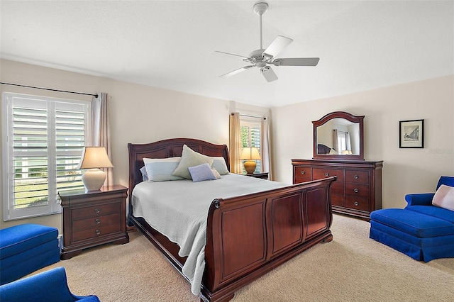 bedroom featuring light colored carpet and ceiling fan