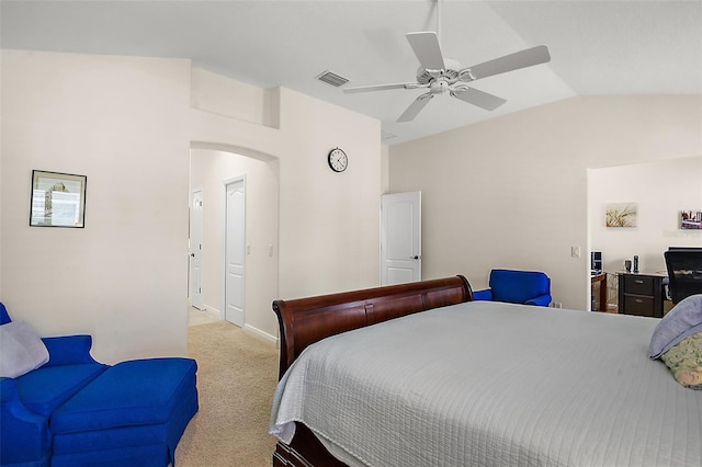 bedroom with a ceiling fan, visible vents, lofted ceiling, arched walkways, and light colored carpet