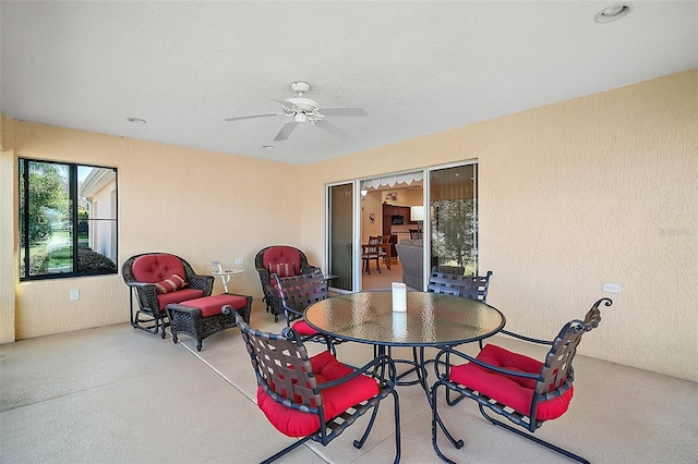 view of patio / terrace with outdoor dining area and a ceiling fan