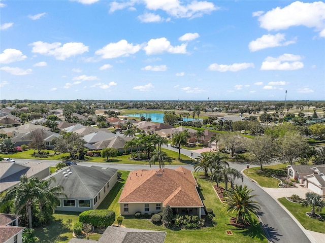 birds eye view of property with a residential view and a water view