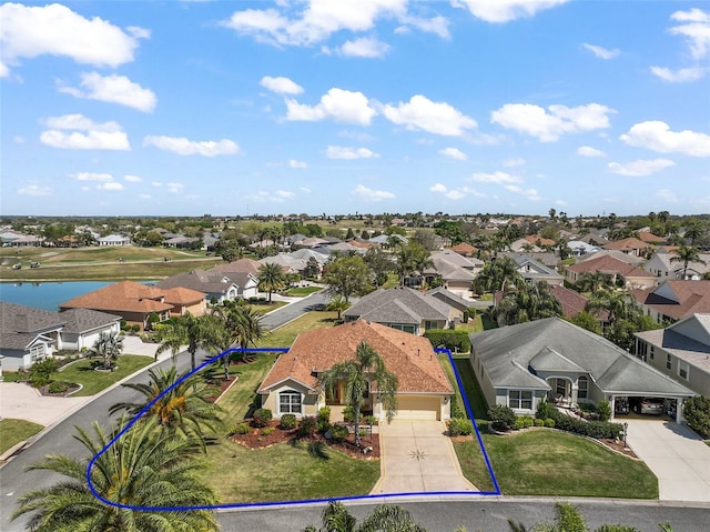 bird's eye view featuring a residential view and a water view