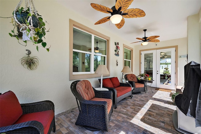 view of patio with french doors and a ceiling fan