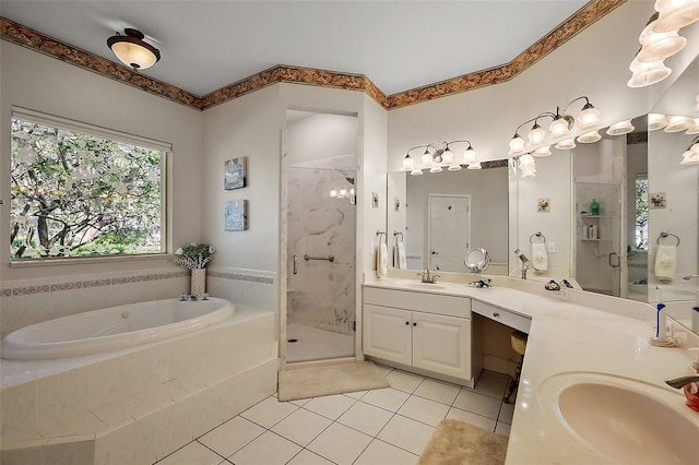 full bath with double vanity, a stall shower, a sink, tile patterned flooring, and a bath