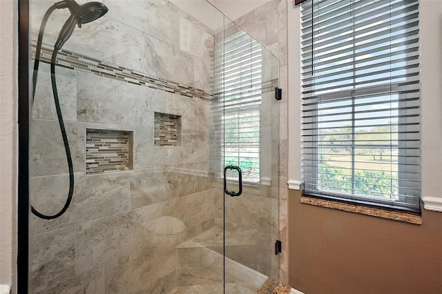 bathroom featuring a shower stall