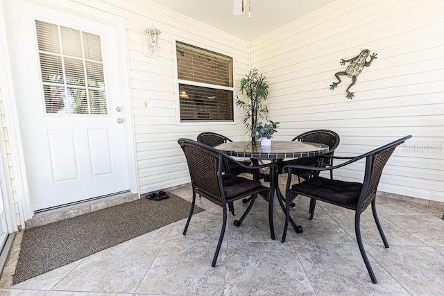 view of patio featuring outdoor dining area