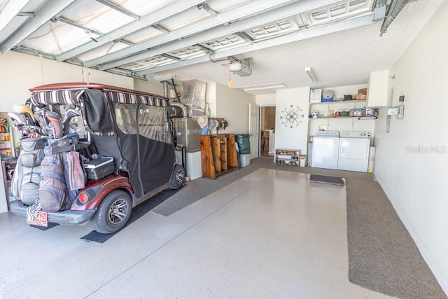 garage featuring a garage door opener and separate washer and dryer