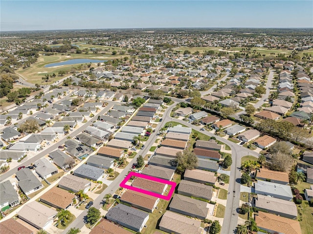 bird's eye view featuring a water view and a residential view