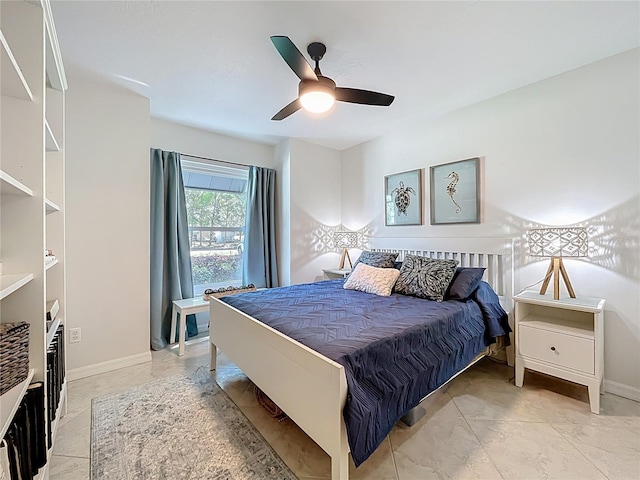 bedroom featuring baseboards and ceiling fan