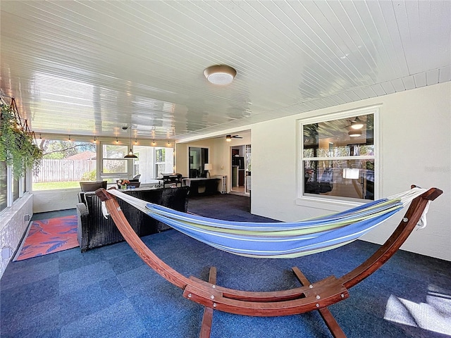 sunroom with wooden ceiling