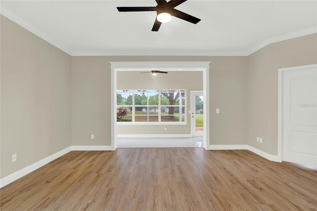 spare room with light wood-type flooring, baseboards, and a ceiling fan