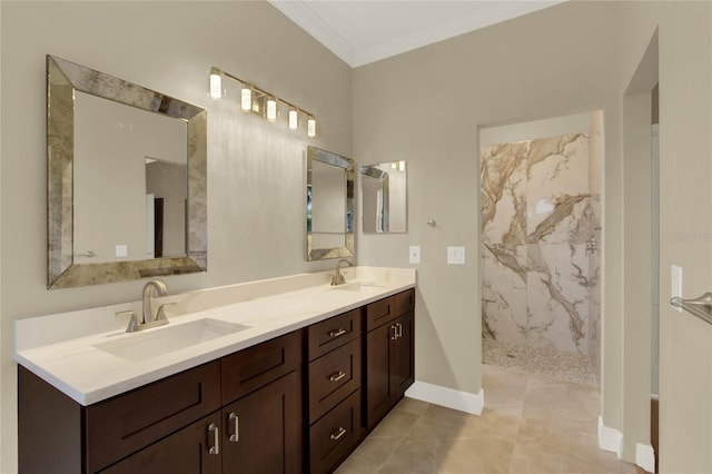 full bath featuring crown molding, double vanity, a marble finish shower, and a sink