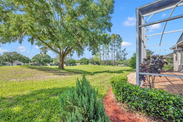 view of yard featuring a lanai