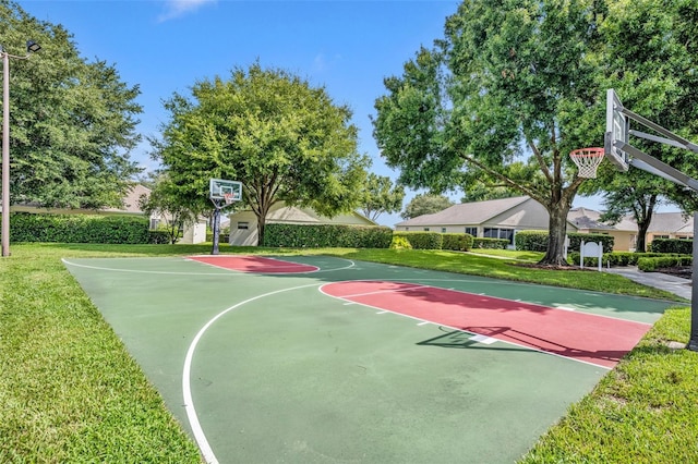 view of basketball court featuring community basketball court and a yard