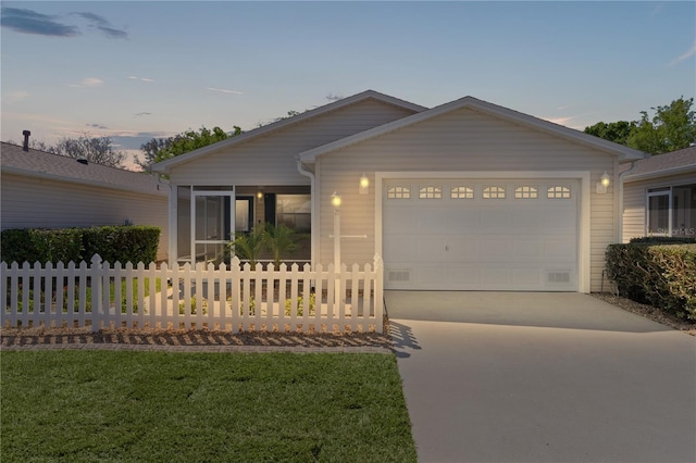 ranch-style house with driveway, a front lawn, a garage, and fence