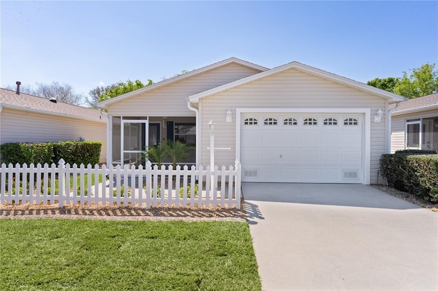 ranch-style house with a front yard, fence, driveway, a sunroom, and a garage