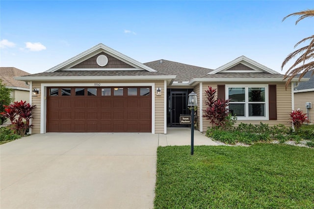 ranch-style house featuring a garage, a front lawn, and driveway