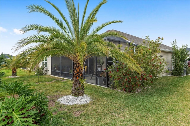 view of yard featuring a sunroom