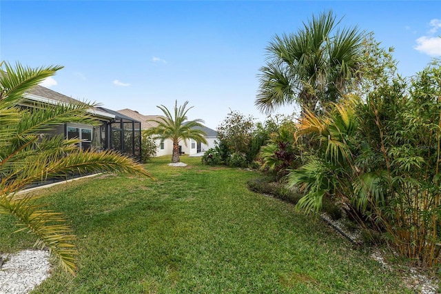 view of yard with a lanai