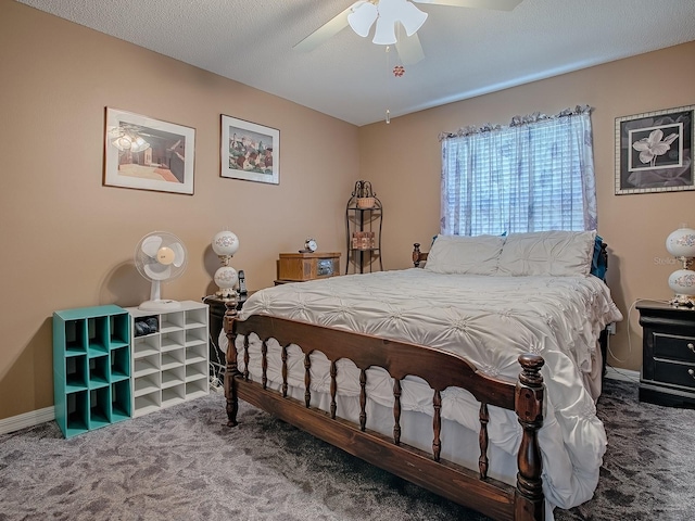 carpeted bedroom featuring baseboards and ceiling fan