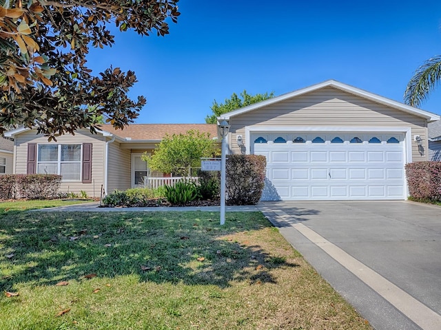 ranch-style house with a garage, roof with shingles, concrete driveway, and a front lawn