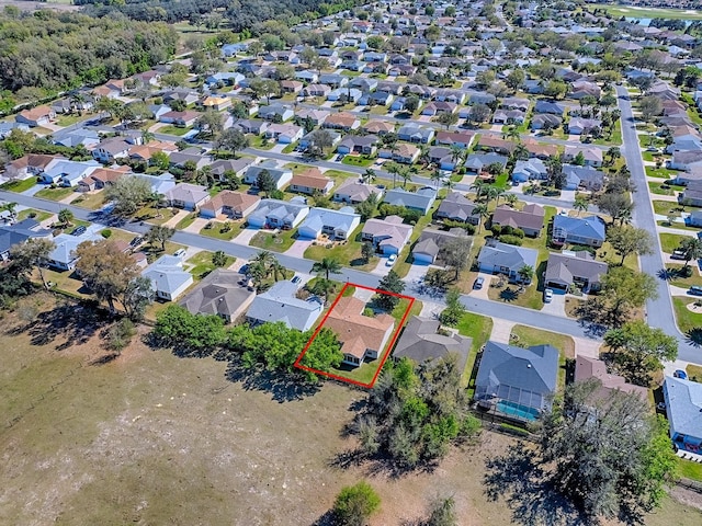 birds eye view of property with a residential view