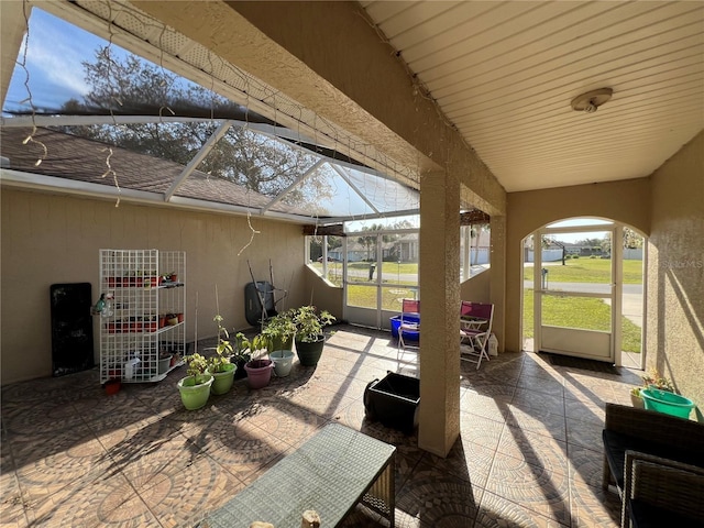 view of patio / terrace featuring glass enclosure