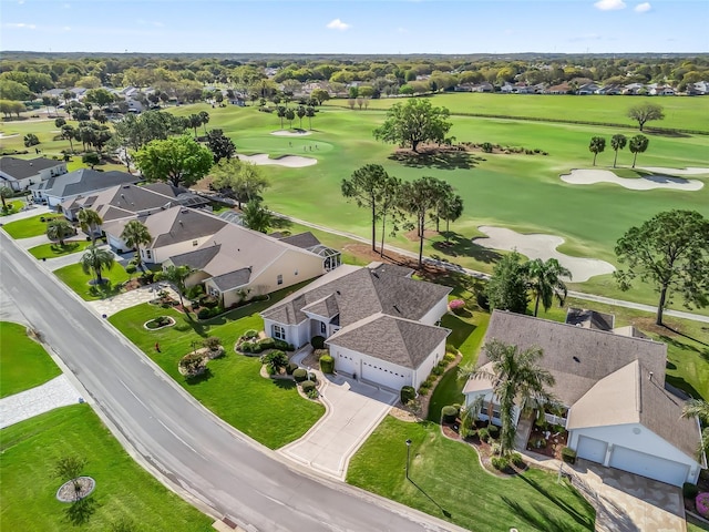 bird's eye view with golf course view and a residential view