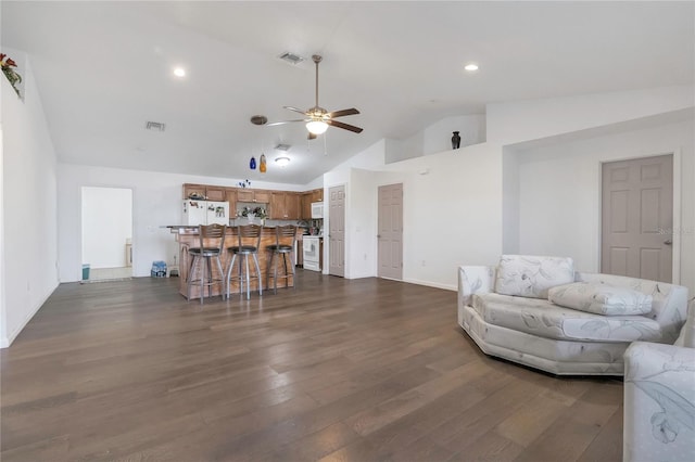 living area with recessed lighting, visible vents, ceiling fan, and dark wood-style flooring